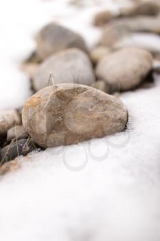 stones in the snow on the nature