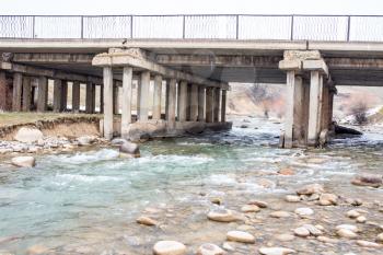 old concrete bridge on the river Sairam-su. Kazakhstan