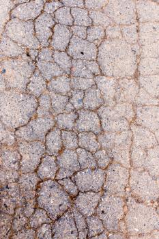 cracks in the old pavement as a background