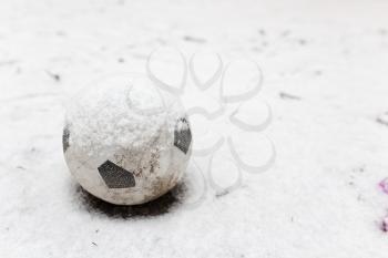 soccer ball in the snow in the winter