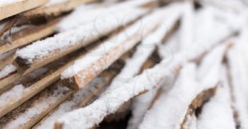 firewood in the snow in the winter