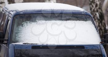 Snow on the window of car in winter