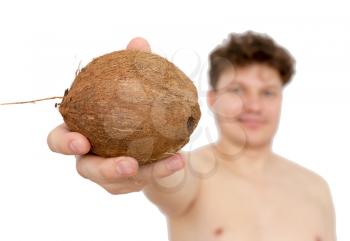 Coconut in a man's hand on a white background