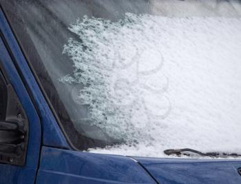 Snow on the window of car in winter