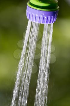 splashes of water from the hose in nature