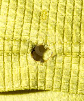 hole from a cigarette on fabric