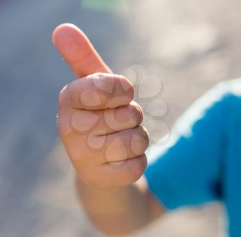 boy's hand with thumb up