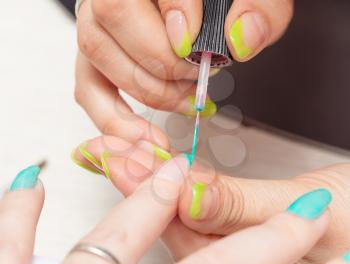 women in a beauty salon manicure