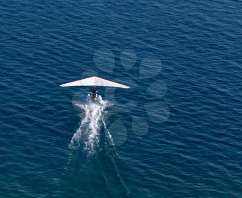 plane takes off from the surface of the water