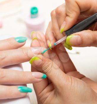women in a beauty salon manicure