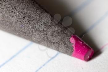 Pink pencil on paper. macro