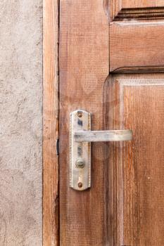 Handle on the old wooden door