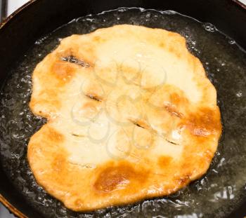 tortilla is fried in a pan
