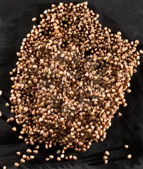 buckwheat on a black background