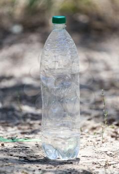 empty plastic bottle on the ground