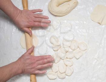 chef rolls the dough
