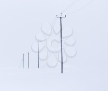 landscape with electric line castelluccio in the snow