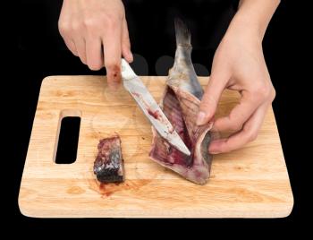 preparation of herring on a board on a black background