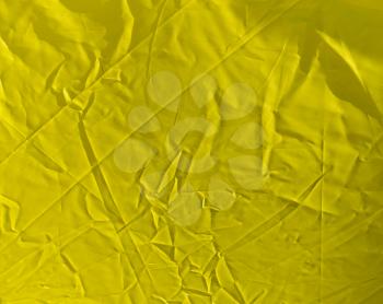 wrinkled yellow cloth as background