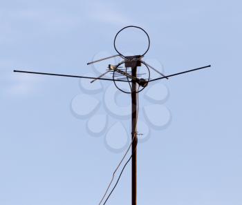 TV antenna on sky background