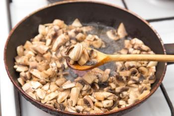 mushrooms fried in a pan