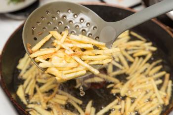 cooking potato fries in oil