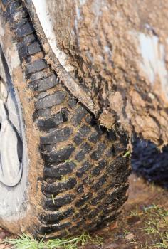 dirty tire SUV in nature