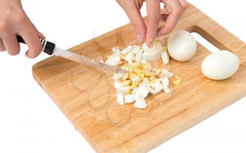 cook eggs on cutting board on a white background