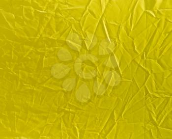 wrinkled yellow cloth as background