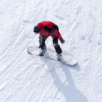 man snowboarding in winter