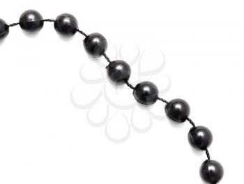 Black beads on a rope on a white background