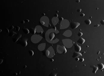 Water droplets on a black background . Abstract