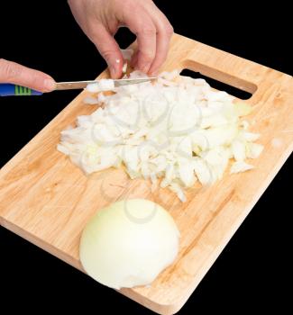 cook onion cut on a board on a black background .