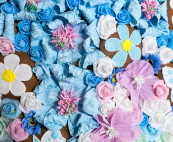 Beautiful artificial blue flowers as a background. texture