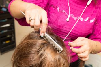Hair styling in a beauty salon . A photo