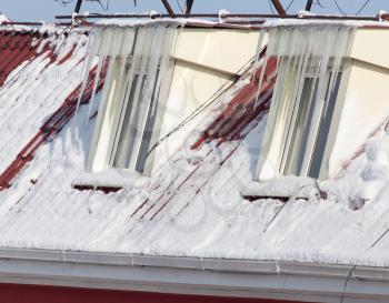 icicles on the house window . A photo