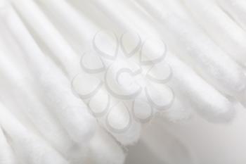 White eared cotton swabs as a background. Macro