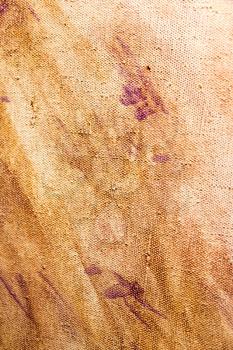 Abstract background of brown paint on canvas .