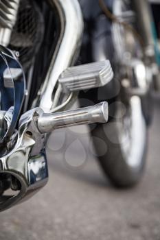 A metal detail on a motorcycle as a background.