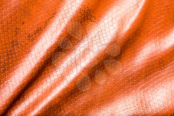 Brown leather material as background. Abstract texture