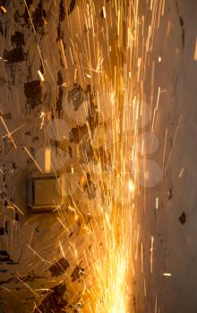 Sparks from cutting metal as a background .