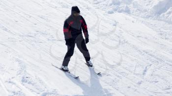 Skier skiing in the snow in winter