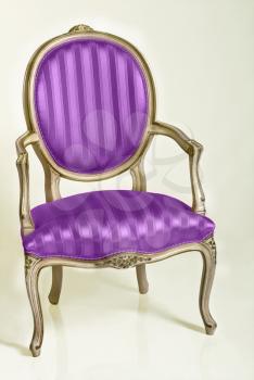 Purple armchair in retro style