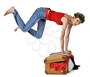 Jumping girl put in order baggage in trunk