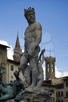 A statue of the Greek God Neptune in a Florence Square