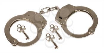 Handcuffs with a three decorative keys on white background