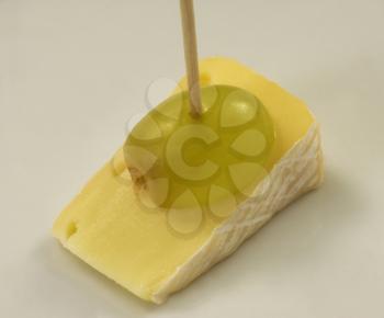 Yellow cheese with grape - catering