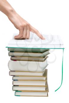 Royalty Free Photo of a Person Pointing to Books
