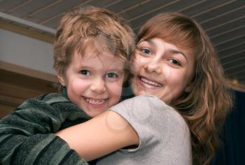 Royalty Free Photo of a Girl Hugging a Boy