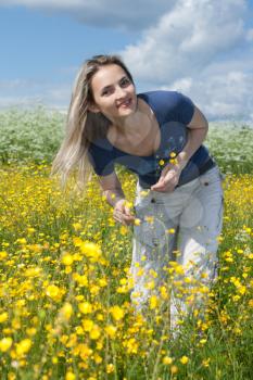 Royalty Free Photo of a Girl in a Field of Flowers